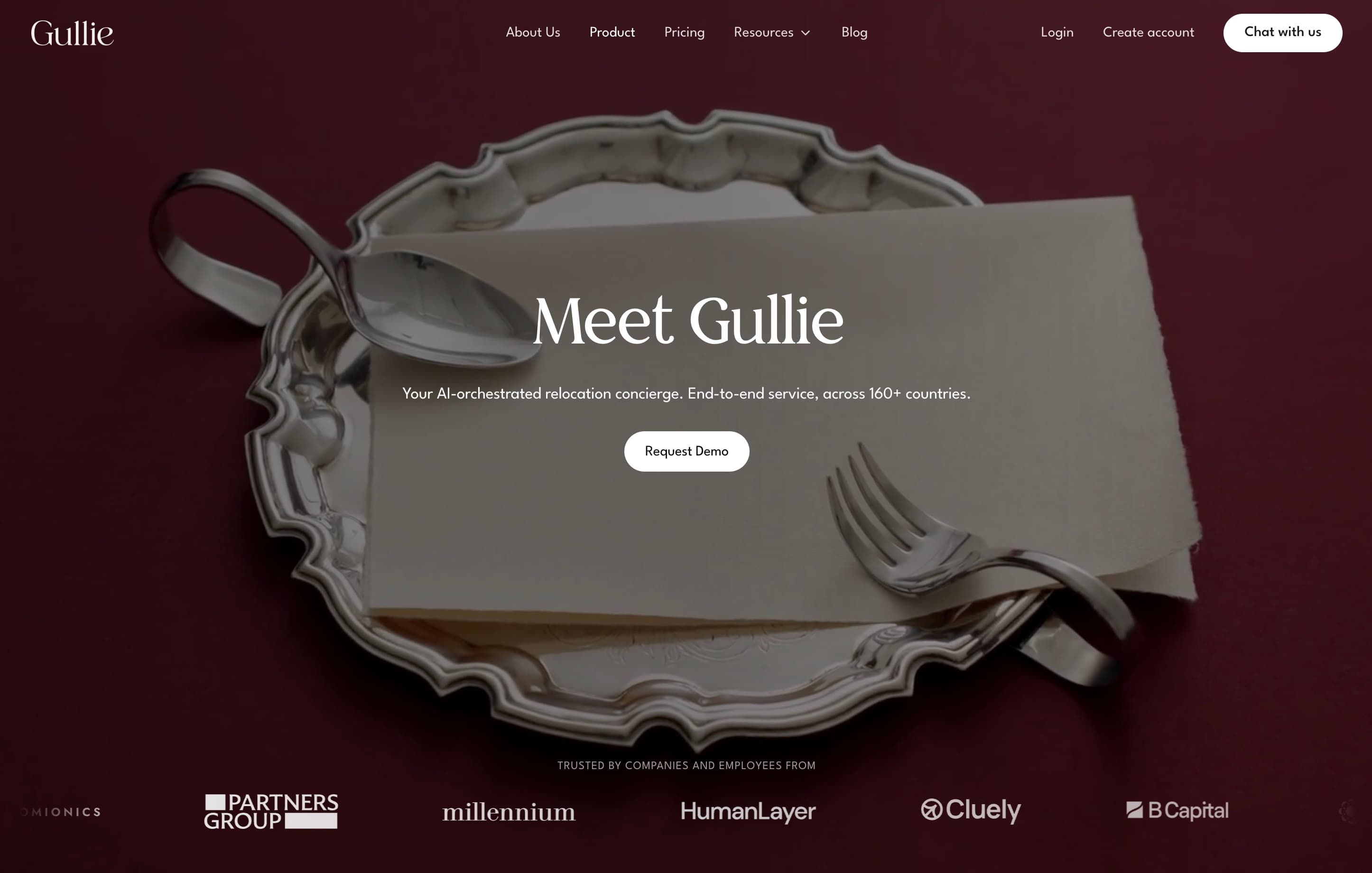 The new Gullie homepage in bordeaux, with a silver tray and a card that reads Meet Gullie