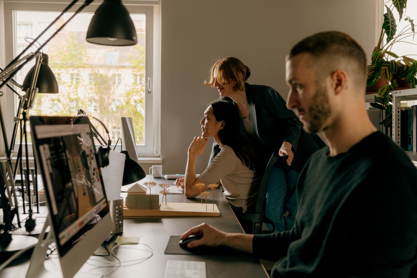 Gullie teammates working side by side in the office
